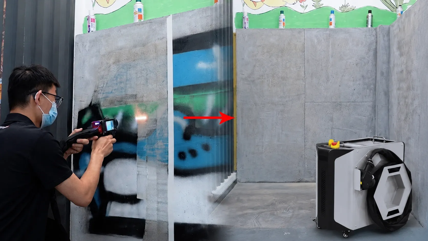 Operator using a portable laser cleaner on-site to strip paint from a wall
