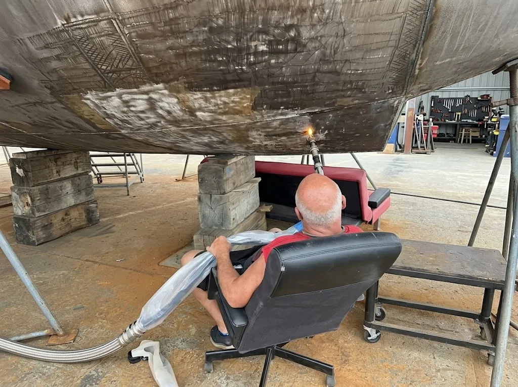 Water-cooled laser cleaning head for sustained marine corrosion removal