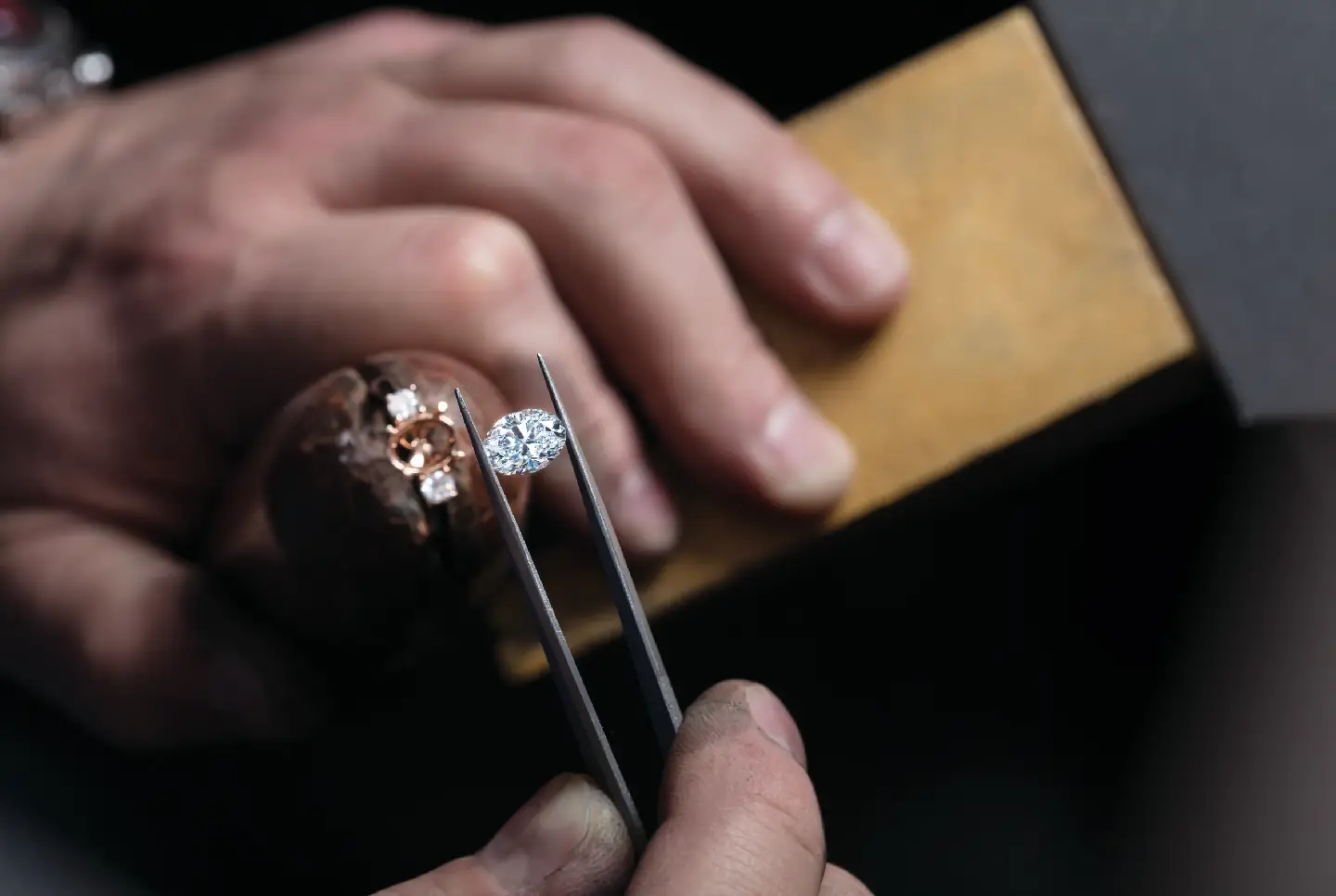 Prong retipping near a diamond on a stone-set ring