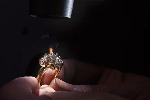Stone-set jewelry repair with reduced heat risk
