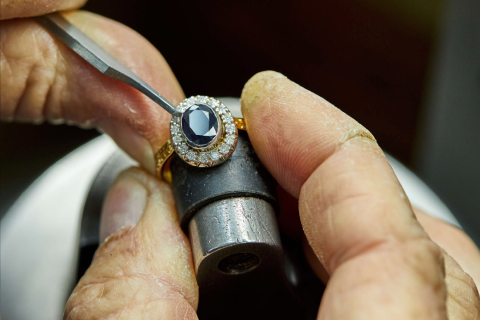 Jewelry laser welder retipping a prong on a stone-set ring