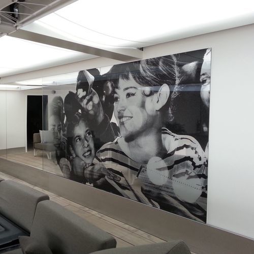 A printed accent wall along a hotel corridor